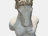 marble bust of a man with a goat ' s head in the form of a bust