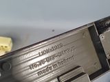 a person holding a piece of metal that has been cut in half