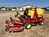 an image of a red lawn mower parked in the dirt