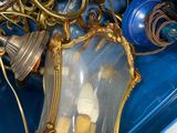 a blue box with a bunch of old lamps inside of it