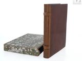 a book that is sitting on a table next to a book