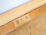 an image of a close up of a piece of wood with a number on it