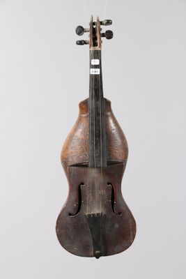 a close up of a violin hanging from a string