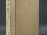 a book with a brown cover sitting on top of a table