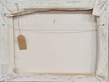 a picture of a picture frame with a tag on it