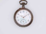 a pocket watch that is hanging on a wall