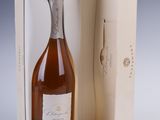 the bottle of wine is in the box and ready to be opened