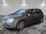 a picture of a silver volkswagen golf in a garage