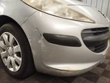 a silver car that is sitting in a garage