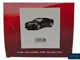 a box with a picture of a black car on it