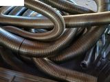 a pile of metal pipes sitting on top of a table