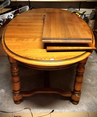 a wooden table with a laptop on top of it