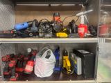 many tools and tools on the shelf in the cabinet