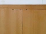 a close up of a wooden cabinet with a hole in it