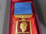 an image of a medal in a case with a ribbon on it