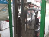 a forklift truck that is parked in a warehouse