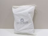 the bag is white and has a logo on it
