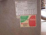 a metal box with a sign on it that says made in italy