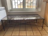 a small table with a marble top in a kitchen
