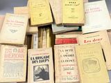 several old books are stacked on top of each other on a table