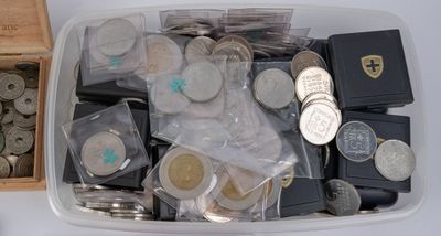 a box full of silver and silver coins and a box of silver and silver coins