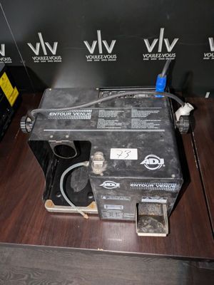 a machine that is sitting on top of a wooden table