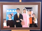 a picture of a painting of a family on a easel