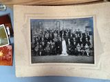 an old photo of a group of people posing for a picture
