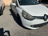 a picture of a white car parked in a parking lot
