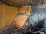 a dirty seat in the back of a truck