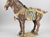 statue of a horse with a saddle on it ' s back