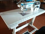 a sewing machine that is sitting on a table