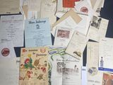 many old letters and old postcards on the table