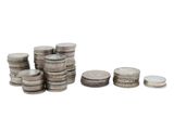 a pile of coins sitting next to each other on top of a white surface