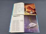 an open book with a picture of a space station on it