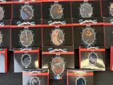 a lot of watches that are on display on the table