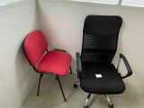 two office chairs next to each other in a room