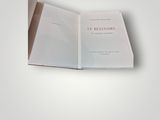 an open book with a picture of a cat on top of it