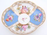 a blue and white plate with a picture of a woman on it