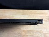a laptop that is sitting on a wooden table