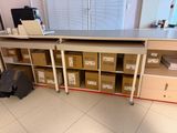 a desk with a laptop on top of it in a room
