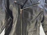 a black leather jacket on a mannequin head