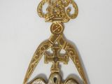 a close up of a gold medal on a white surface