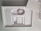 a white box with a charger and a charger attached to it