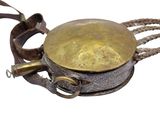 a metal object with a rope around it on a white surface