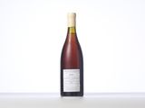 a bottle of wine that is sitting on a table