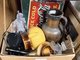 a cardboard box full of items that are sitting on a table