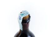 a bottle of wine with a cork cap on it