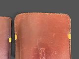leather case for a cell phone with a brown leather cover