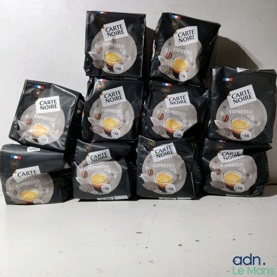 several bags of coffee are stacked on top of each other